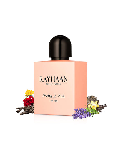 rayhaan perfume pretty in pink perfume bottle surrounded with its ingredients like rose and vanilla shows from behind the bottle against white background