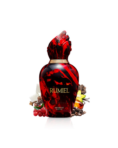 rumiel arabiyat prestige perfume bottle surrounded by fragrance notes like pink pepper and coffshows against white backgrounde 