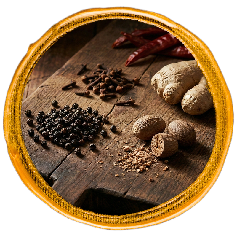Spices including black pepper, cloves, and ginger on a wooden surface with a wooden frame.