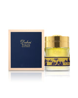 spirit of dubai turath perfume bottle shows beside its packaging against white background