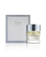 spirit of dubai bahar perfume bottle shows beside its packaging against white background