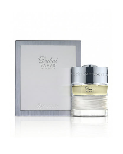 spirit of dubai bahar perfume bottle shows beside its packaging against white background