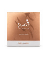 Al Naseem Swiss Arabian Dukhoon bakhoor box in a metallic rose gold color with a white bottom band, shown on a plain white background.