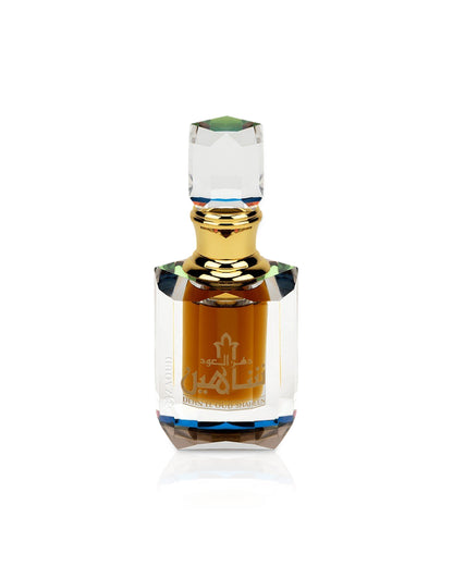 Dehn el oud shaheen Perfume oil bottle with gold cap and clear glass body on a white background