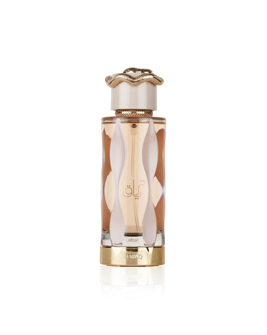 Lattafa teriaq Perfume bottle with gold cap and decorative design on a white background