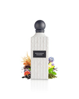 white regent diamond perfume bottle surrounded with fragrance notes like fig and cardamom shows against white background