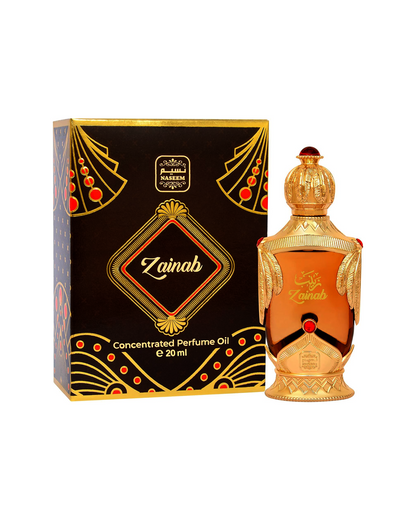 zainab perfume oil golden bottle beside its box shows against white background