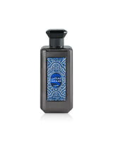zimaya inekas luna Perfume bottle with blue decorative label on a white background
