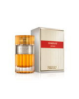 lattafa stardust perfume bottle shows beside its packaging against white background
