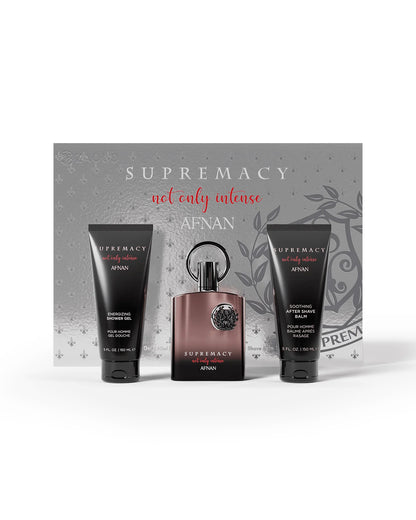afnan supremacy not only intense giftset, featuring a central dark brown bottle with a black cap, flanked by two black shower gel and body wash tubes, all set against a gray decorative backdrop card.
