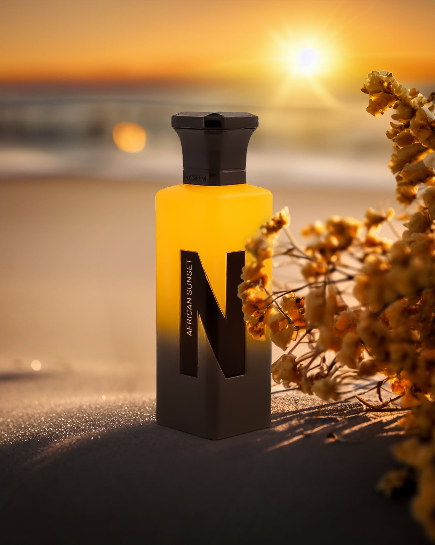 african sunset aqua parfum bottle over sand against sunset