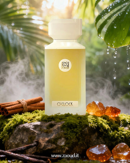 A bottle of O’Clock perfume surrounded by amber stones and cinnamon sticks resting on a moss-covered stone, set against a lush natural background with greenery.