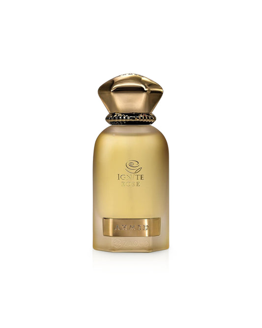 Ahmed al maghribi ignite rose Gold perfume bottle with decorative cap on a white background