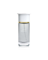 ahmed al maghribi musk amiri Clear glass perfume bottle with gold accent on a white background