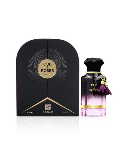 ahmed al maghribi oud and roses extrait perfume bottle shows beside ita packaging against white background