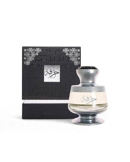 ahmed al maghribi hirfah perfume bottle shows beside its packaging against white background