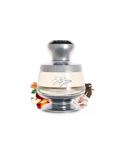 ahmed al maghribi hirfah perfume bottle surrounded by fragrance notes like apple and oud wood shows against white background