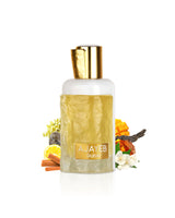 ajayeb dubai portrait gold by lattafa perfume bottle surrounded with its ingredients like mango and jasmine with many others shows from behind the bottle against white background