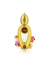 ajmal wisal dhahab perfume bottle surrounded with fragrance notes like apple and rose shows against white background