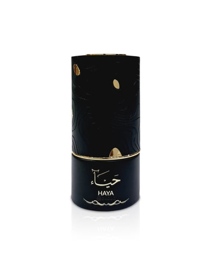 al absar haya Black cylindrical product with gold accents and 'HAYA' branding on a white background