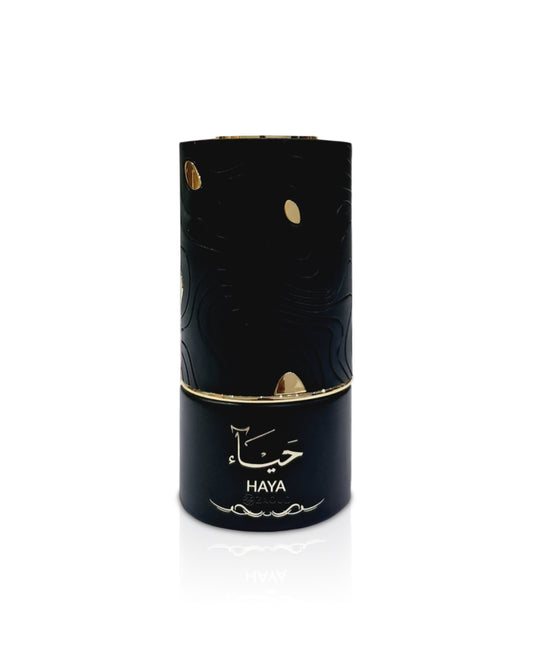 al absar haya Black cylindrical product with gold accents and 'HAYA' branding on a white background