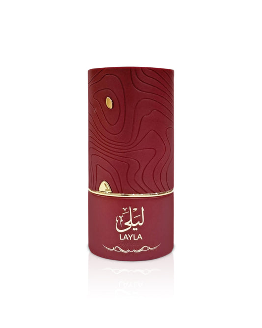 al absar lyla Red cylindrical perfume bottle with gold accents on a white background
