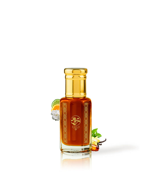 AMARVAIN perfume oil Glass bottle with gold cap surrounded by amber and orange on a white background