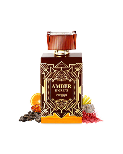 amber is great extrait de parfum by zimaya perfume bottle surrounded with its ingredients like amber and saffron shows from behind the bottle against white background