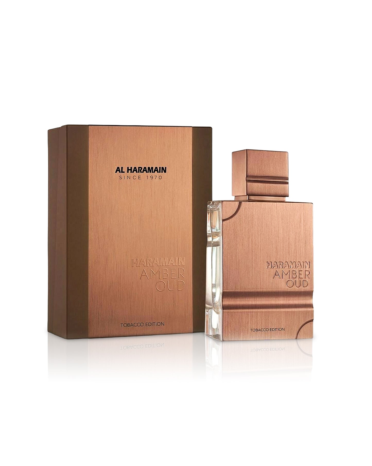 amber oud tobacco edition by al haramain perfume bottle shows beside its box against white background