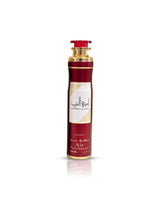 ameerat al arab air freshener Red and gold air freshener bottle with white label on a white background