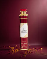 ameerat al arab air freshener Red and gold bottle with decorative elements on a dark red background