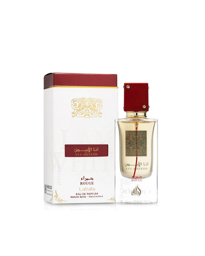 ana abiyedh rouge perfume bottle shows beside its packaging  against white background