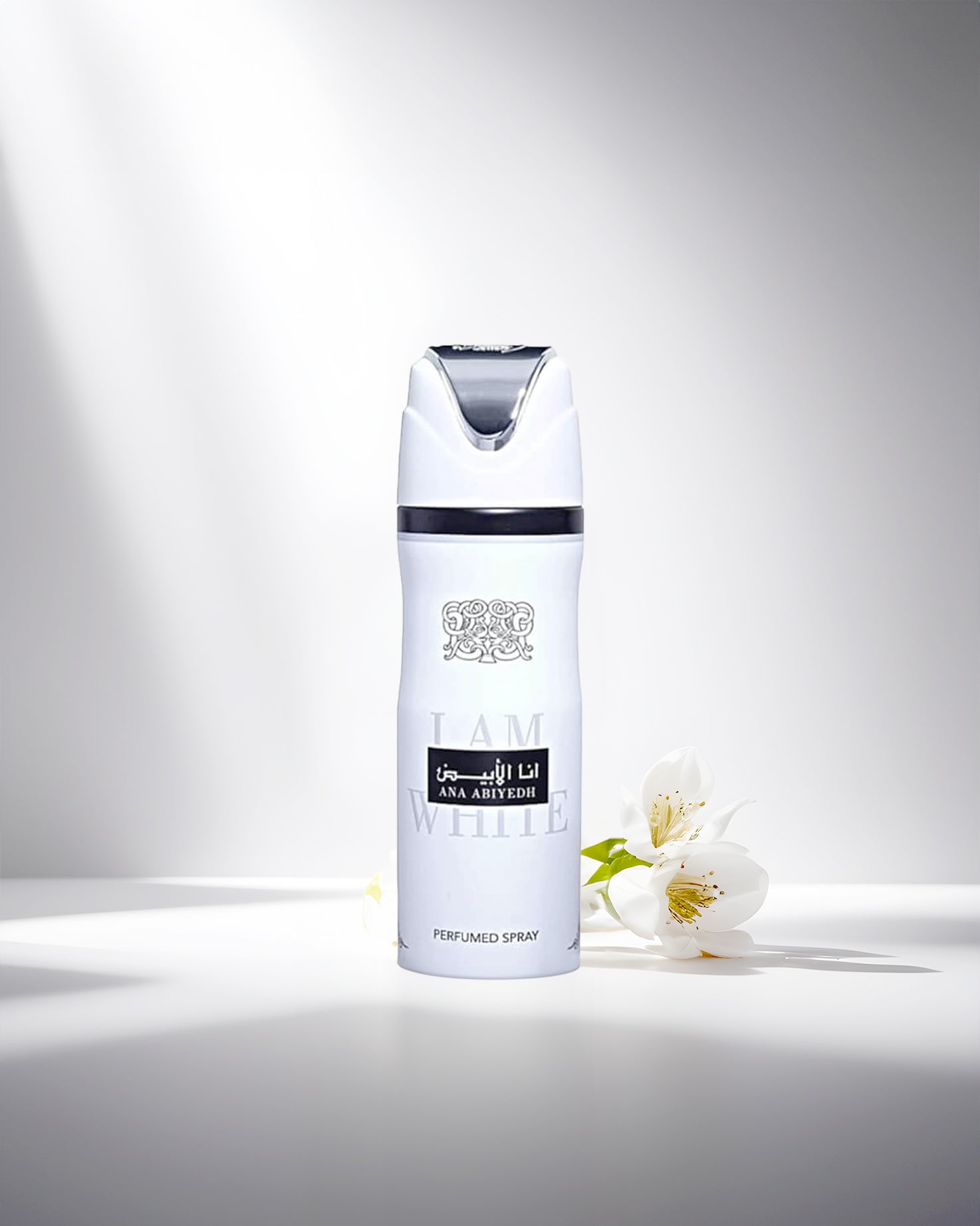 ana abiyedh deodorant bottle photograph over white surface beside a white flower.
