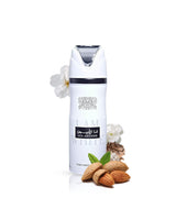 ana abiyedh deodorant bottle surrounded by almond musk against white background