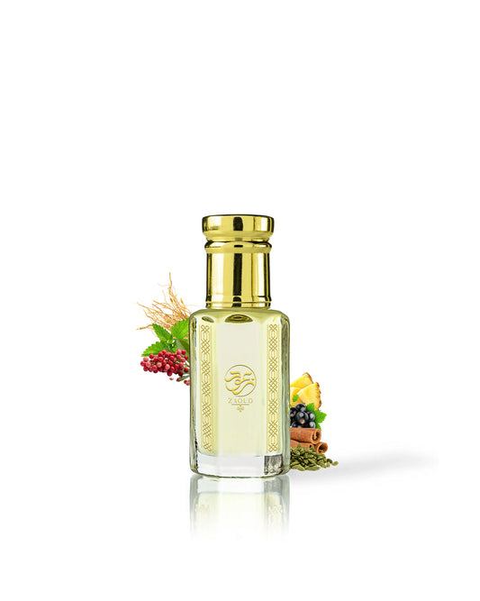 ananas absolu perfume oil bottle with a shiny gold cap and gold decorative patterns, filled with pale yellow liquid. The bottle is centered on a white background with small botanical and spice props near the base.