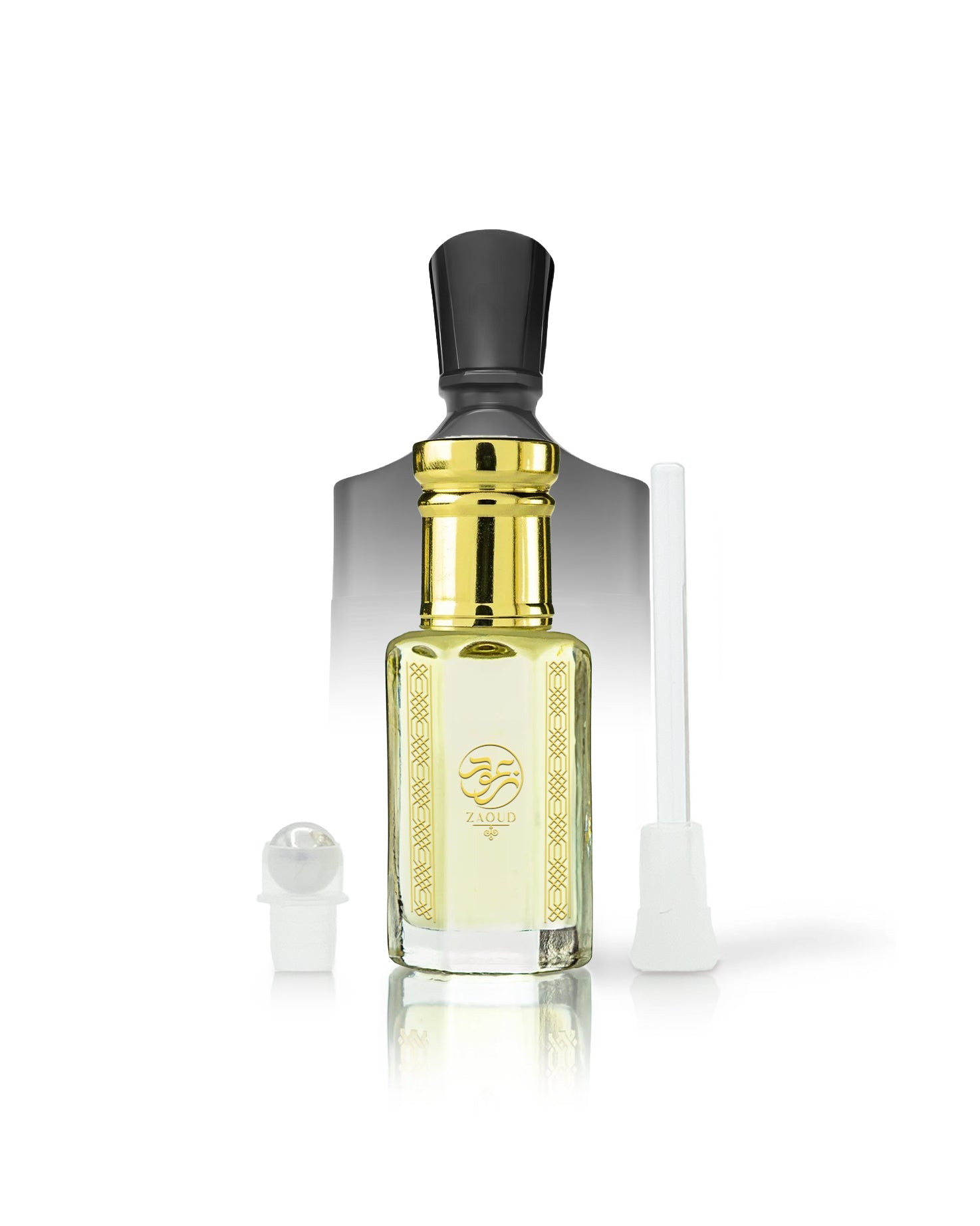 ananas absolu perfume oil bottle with pale yellow liquid, a shiny gold neck, a black cap, and a gold logo on the front. A small white spray atomizer and a white applicator tube are placed beside it on a clean white background.
