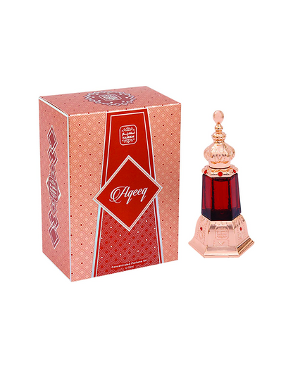 Aqeeq perfume oil by naseem perfumes bottle beside its box shows against white background