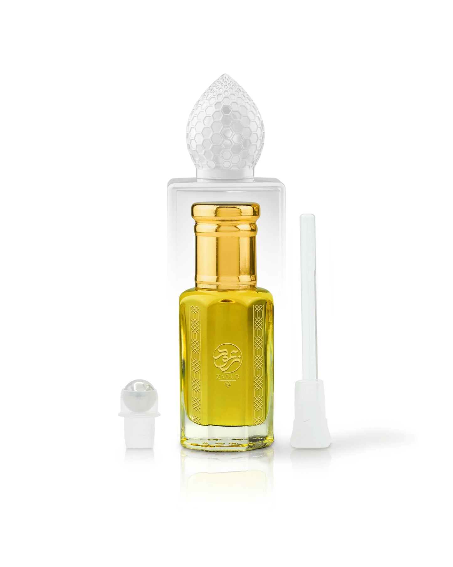 arabian mango Perfume oil bottle with gold cap beside roller and stick with clear cap on a white background