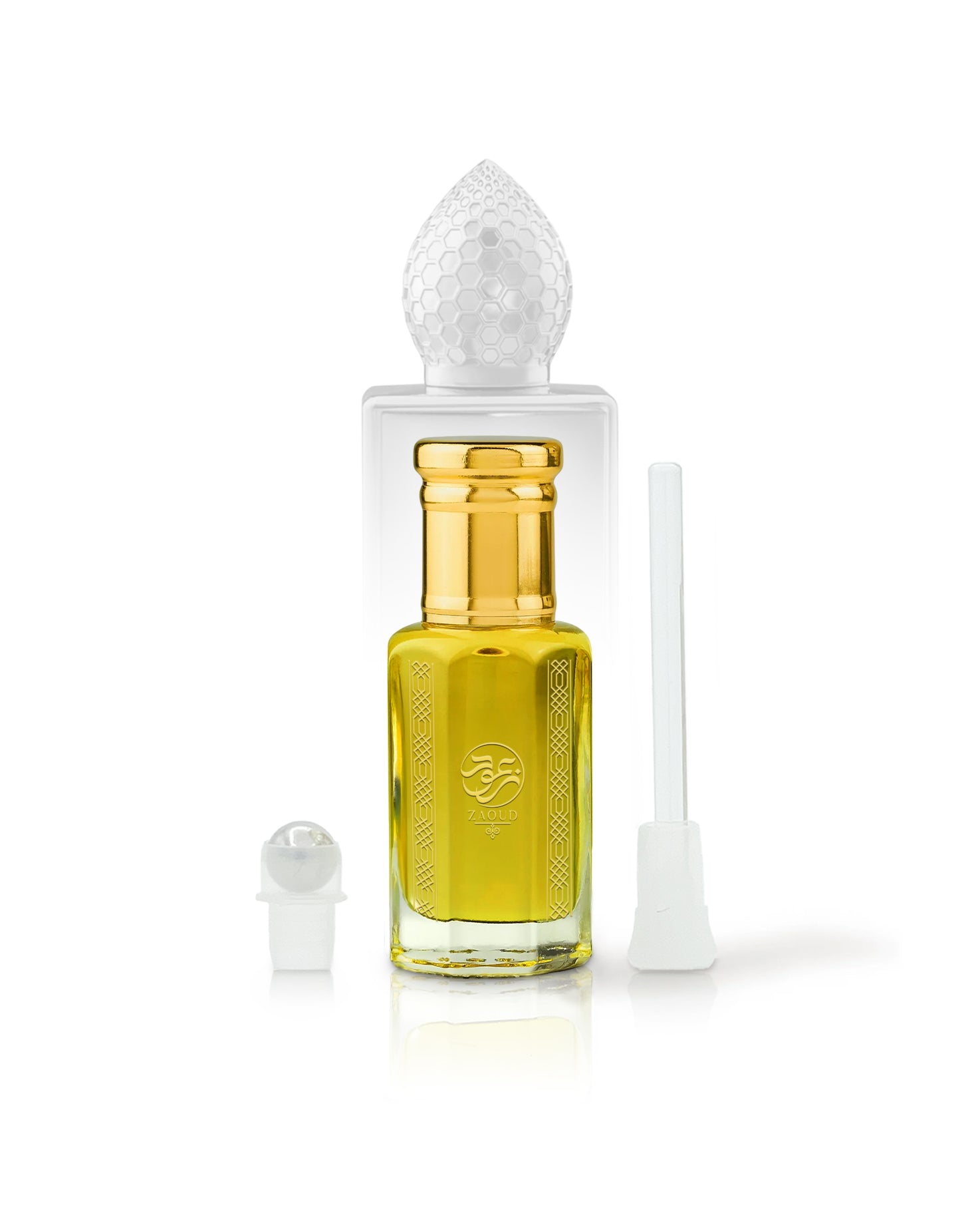 arabian mango Perfume oil bottle with gold cap beside roller and stick with clear cap on a white background