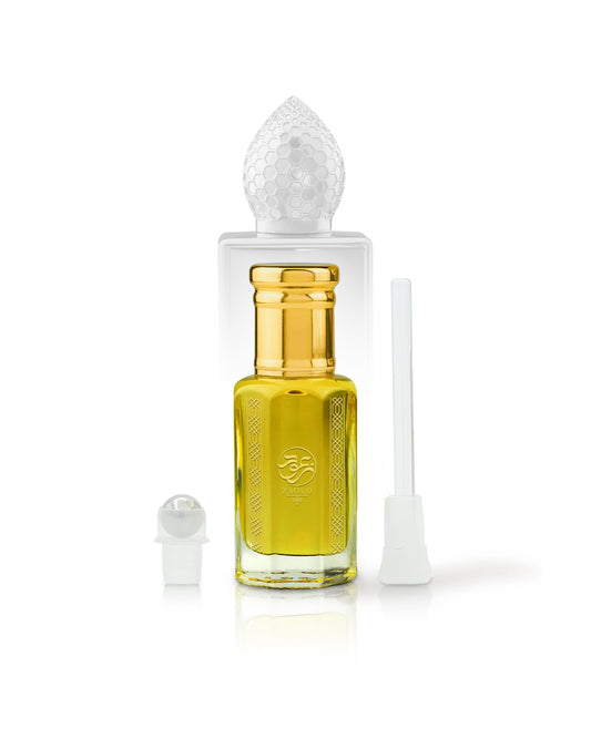 arabian mango Perfume oil bottle with gold cap beside roller and stick with clear cap on a white background
