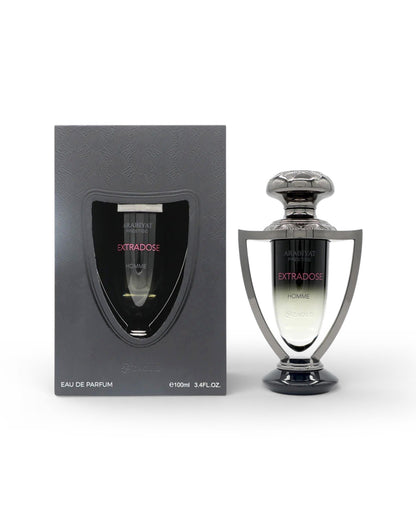 Perfume bottle and packaging with 'arabiyat prestige Extrados homme' branding on a white background