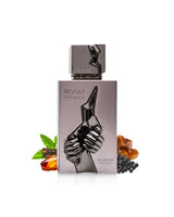 arabiyat prestige revolt uncaged perfume bottle surrounded by fragrance notes like amber and pepper  shows against white background