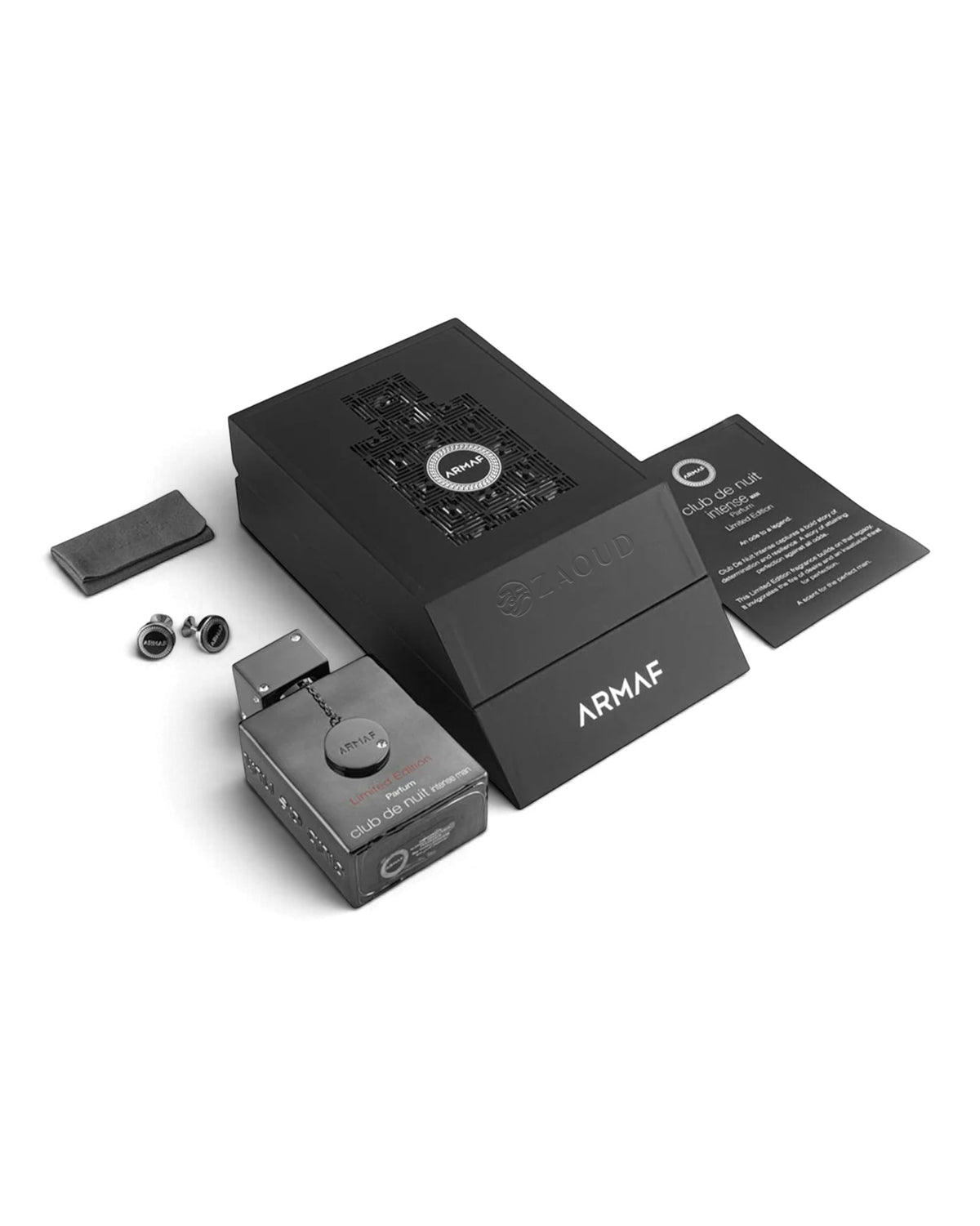 Armaf Club de Nuit Limited Edition parfum bottle and its packaging on a white background, including the main black box, a separate items, a black button and a printed instruction card.