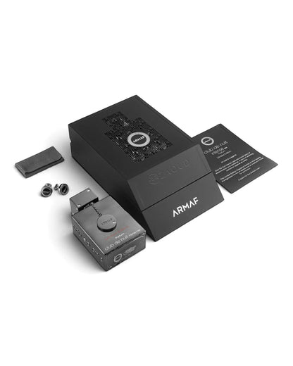 Armaf Club de Nuit Limited Edition parfum bottle and its packaging on a white background, including the main black box, a separate items, a black button and a printed instruction card.