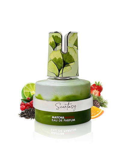 armaf Scentasy matcha magix perfume bottle surrounded by fruits and tea shows against white background