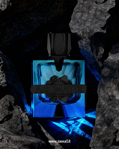 Blue and black Aromatix  Magnetiq by french avenue perfume bottle on a rocky background