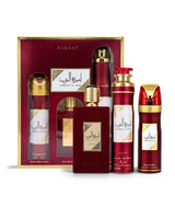 Asdaaf ameerat al arab gift set in a red and gold box, containing a perfume spray, a perfume air freshener, and a perfume spray bottle shows against white background