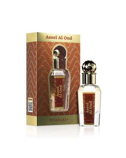 khadlaj aseel al oud perfume oil bottle shows beside its box against white background 