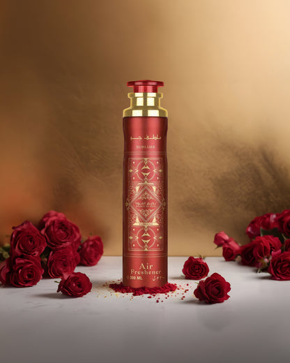 badee al oud sublime air freshener bottle photograph surrounded with red roses