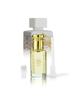 badr wafi perfume oil bottle shows with lattafa perfume bottle behind against white background